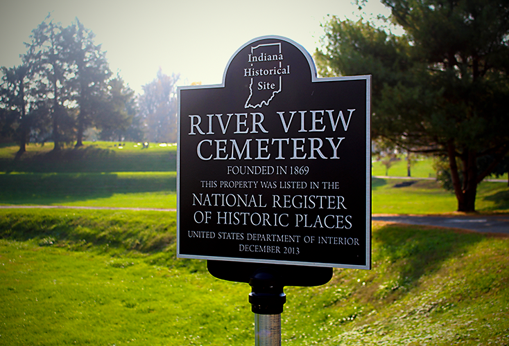 A plaque declaring River View
              Cemetery an Indiana Historical Site and listed in the National Register of Historical Places.